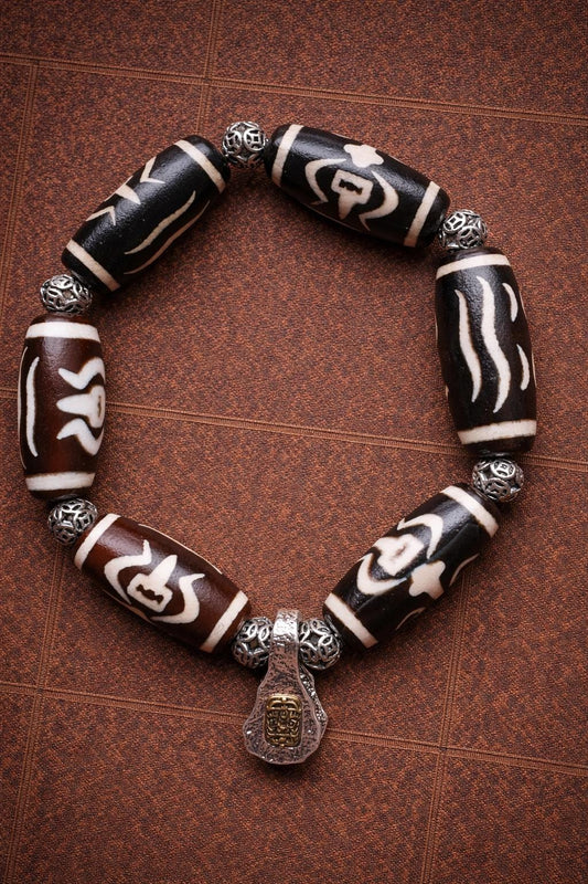 Tibetan Dzi Bead Bracelet – Tibetan Style with Silver Spacer Beads